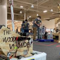 The Wooden Wonder, one of the robots brought by a MEZ team, sits on the field waiting for the next match.